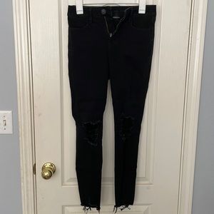 American Eagle black ripped skinny jeans.